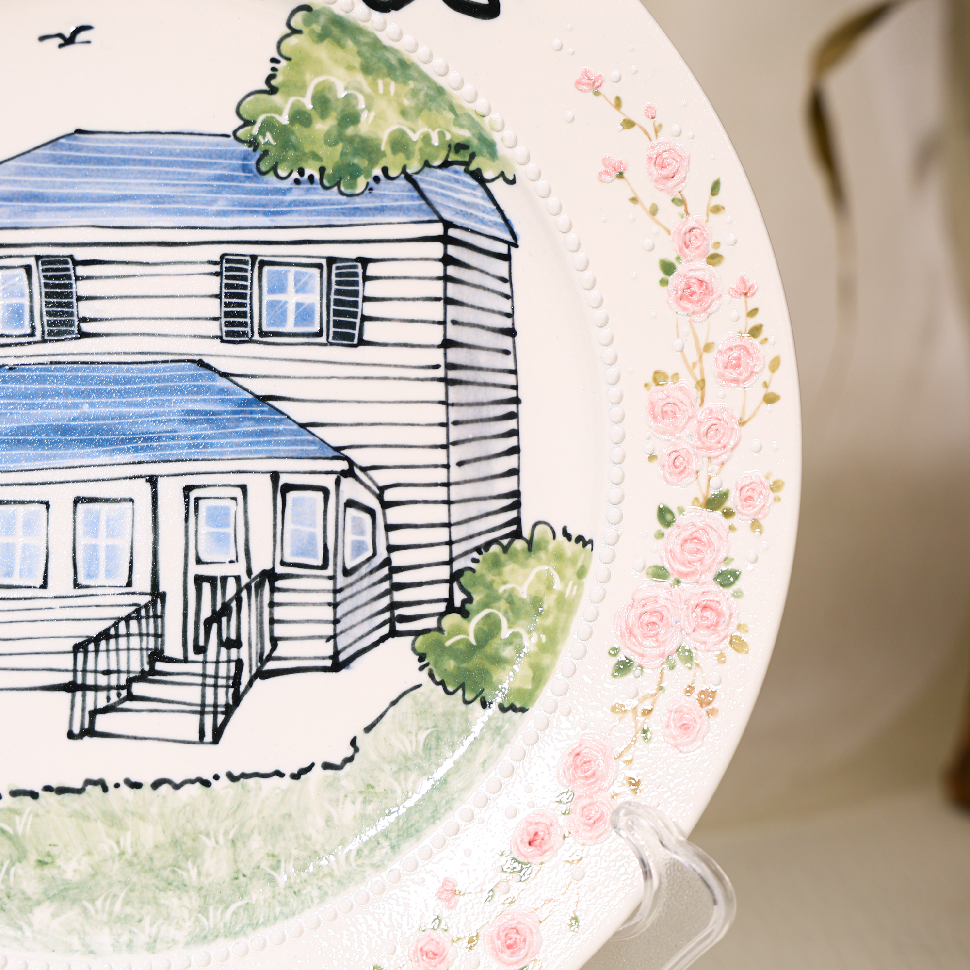 Custom round house portrait plate with pink floral border - detail and angled view