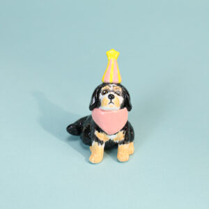 handmade black and tan spaniel ceramic birthday cake topper with candle holder
