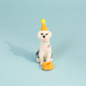 Hand-painted white dog cake topper candle holder with yellow party hat