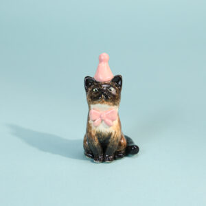 Hand-painted black cat cake topper candle holder with pink party hat and bow