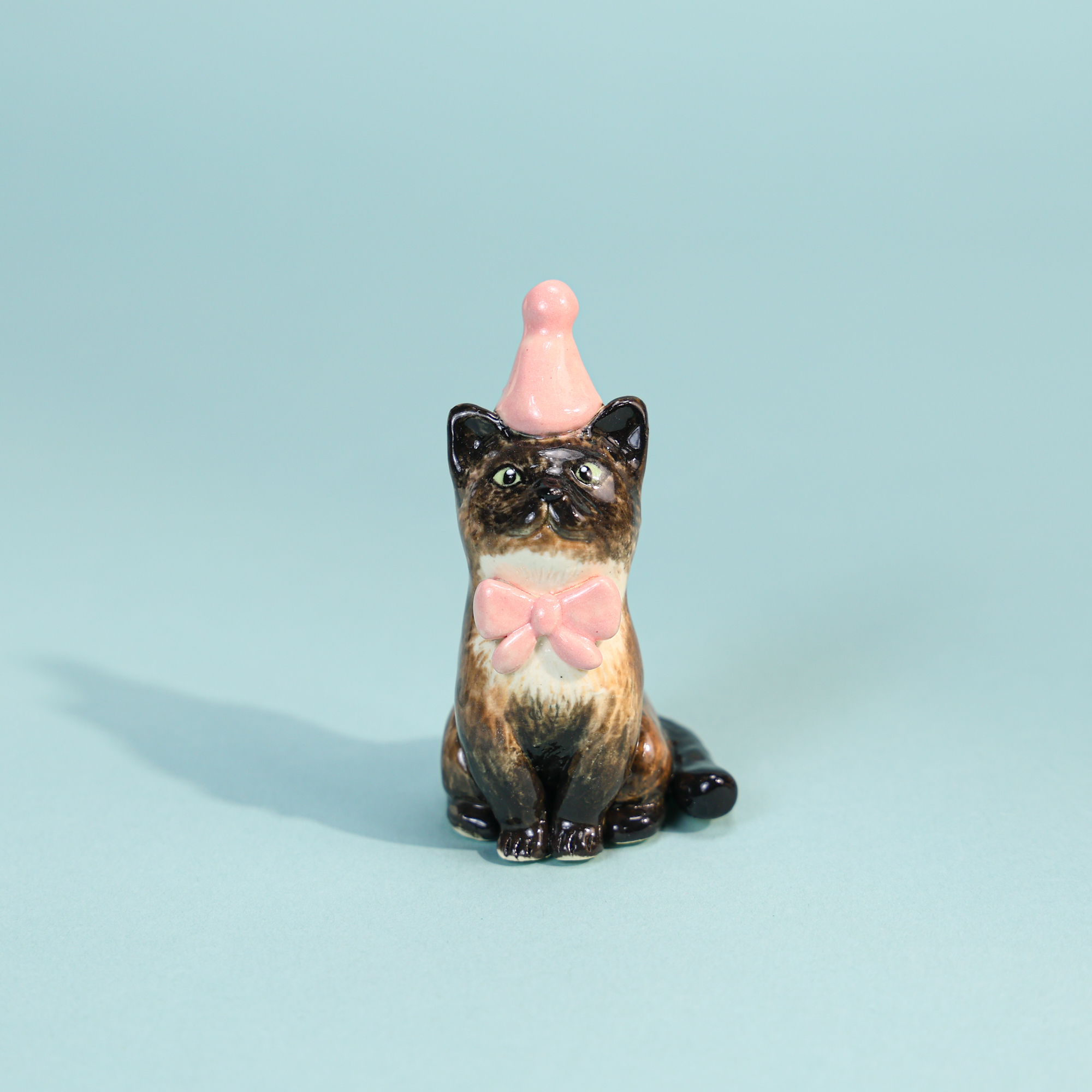 Hand-painted black cat cake topper candle holder with pink party hat and bow