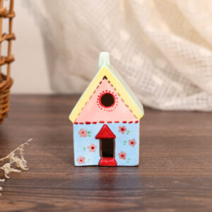 Hand-painted floral cottage ceramic house ornament with blue walls and pink flower details
