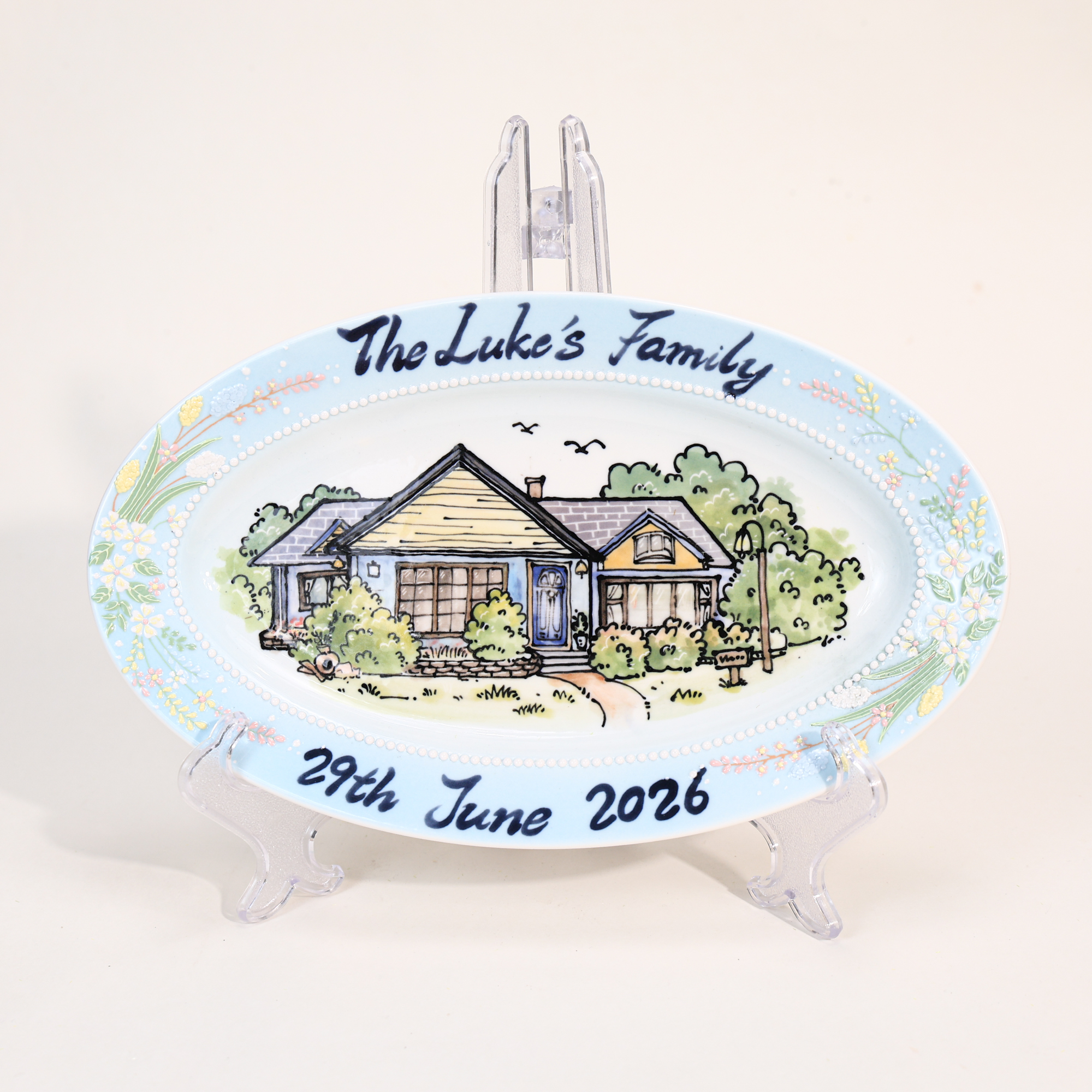 Custom oval house portrait plate with blue floral border - detail and angled view