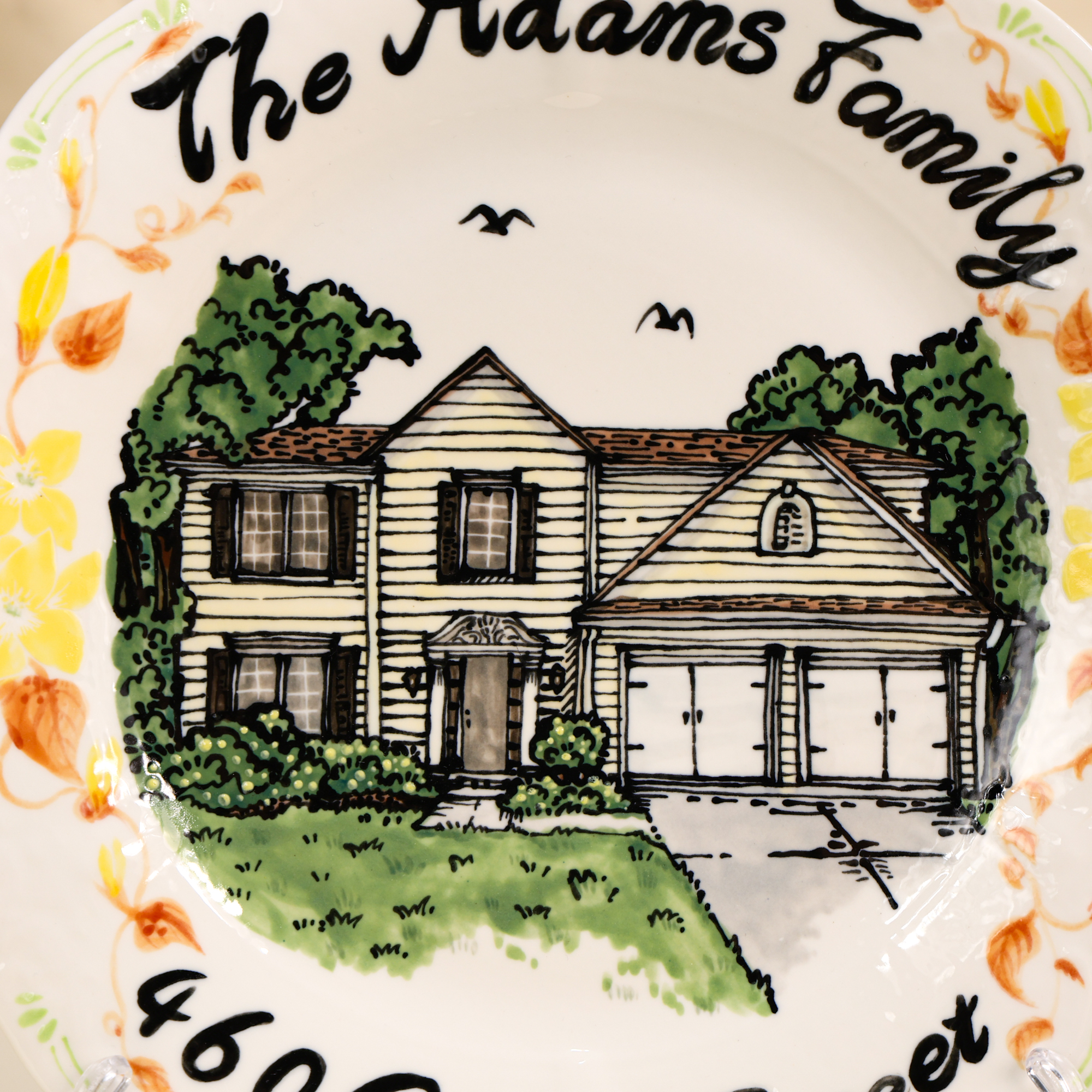 Custom scalloped house portrait plate with floral border - detail and angled view