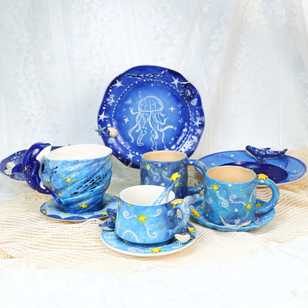 A blue porcelain tea set with cups, plates and serving pieces