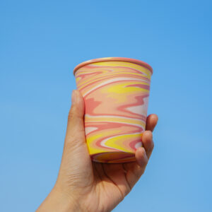 All Things Flourish marbled ceramic cup in pink yellow and white tones