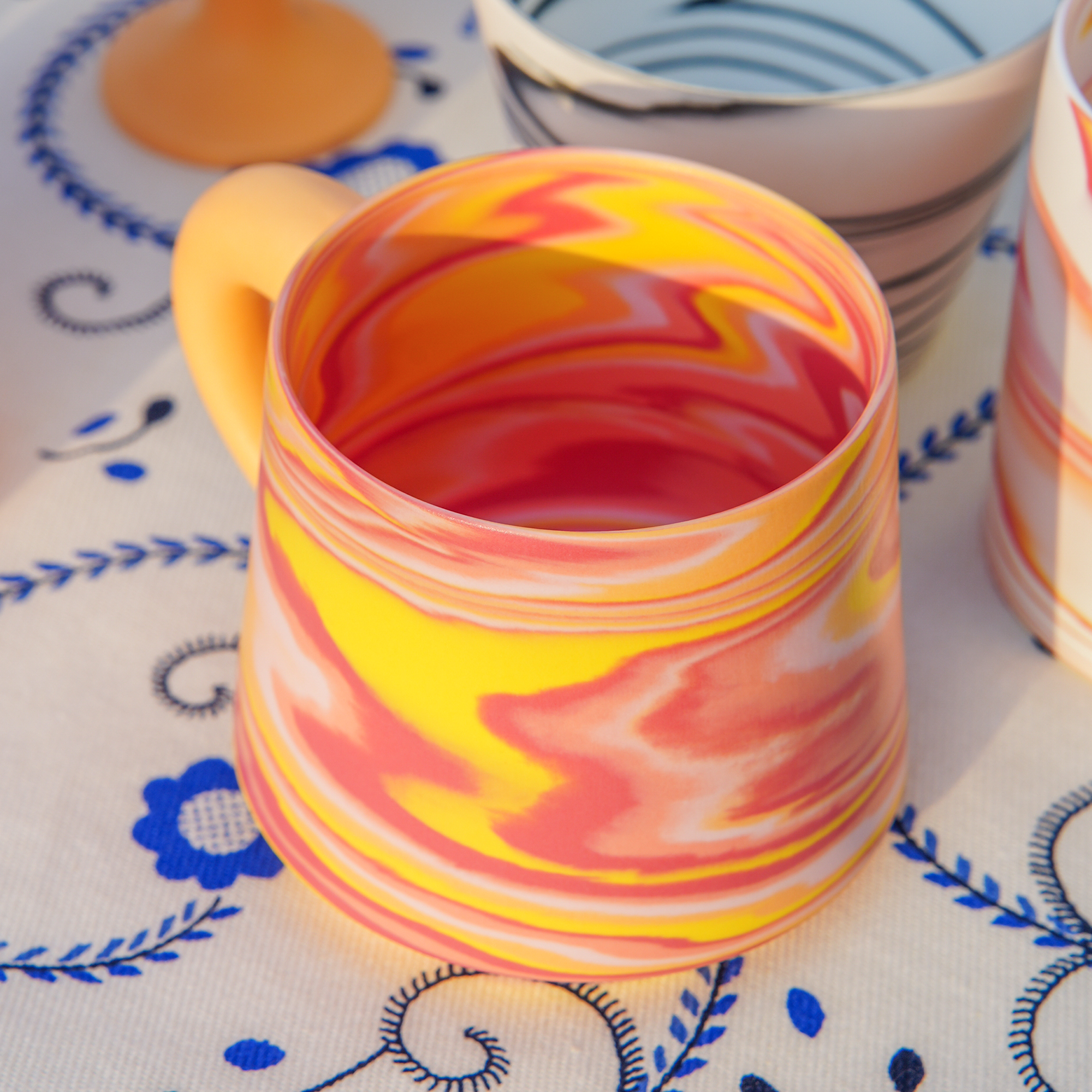 All Things Flourish marbled ceramic mug with rounded handle - detail view